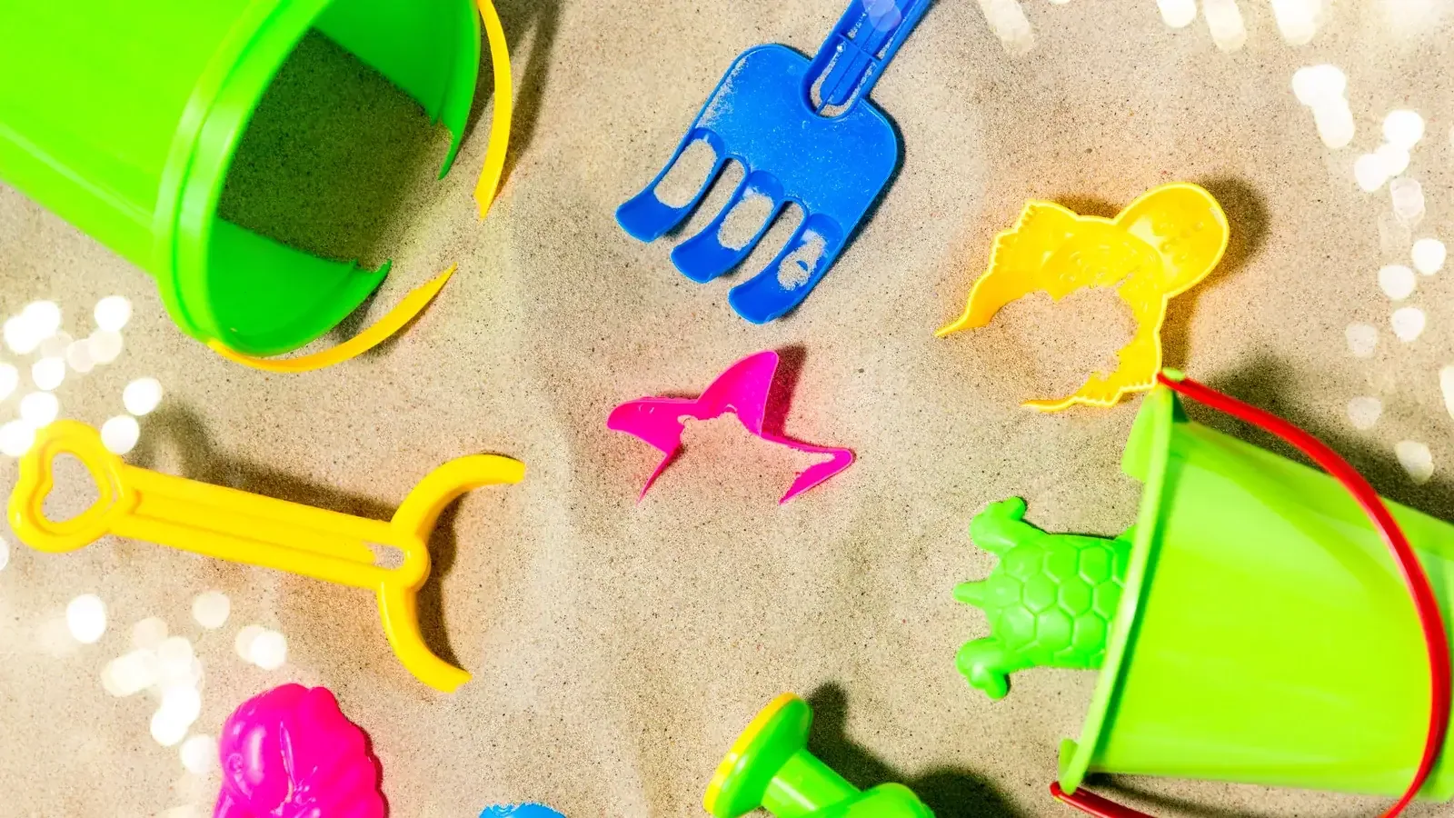 Bucket, spade and sand toys set out for outdoor water and sand play