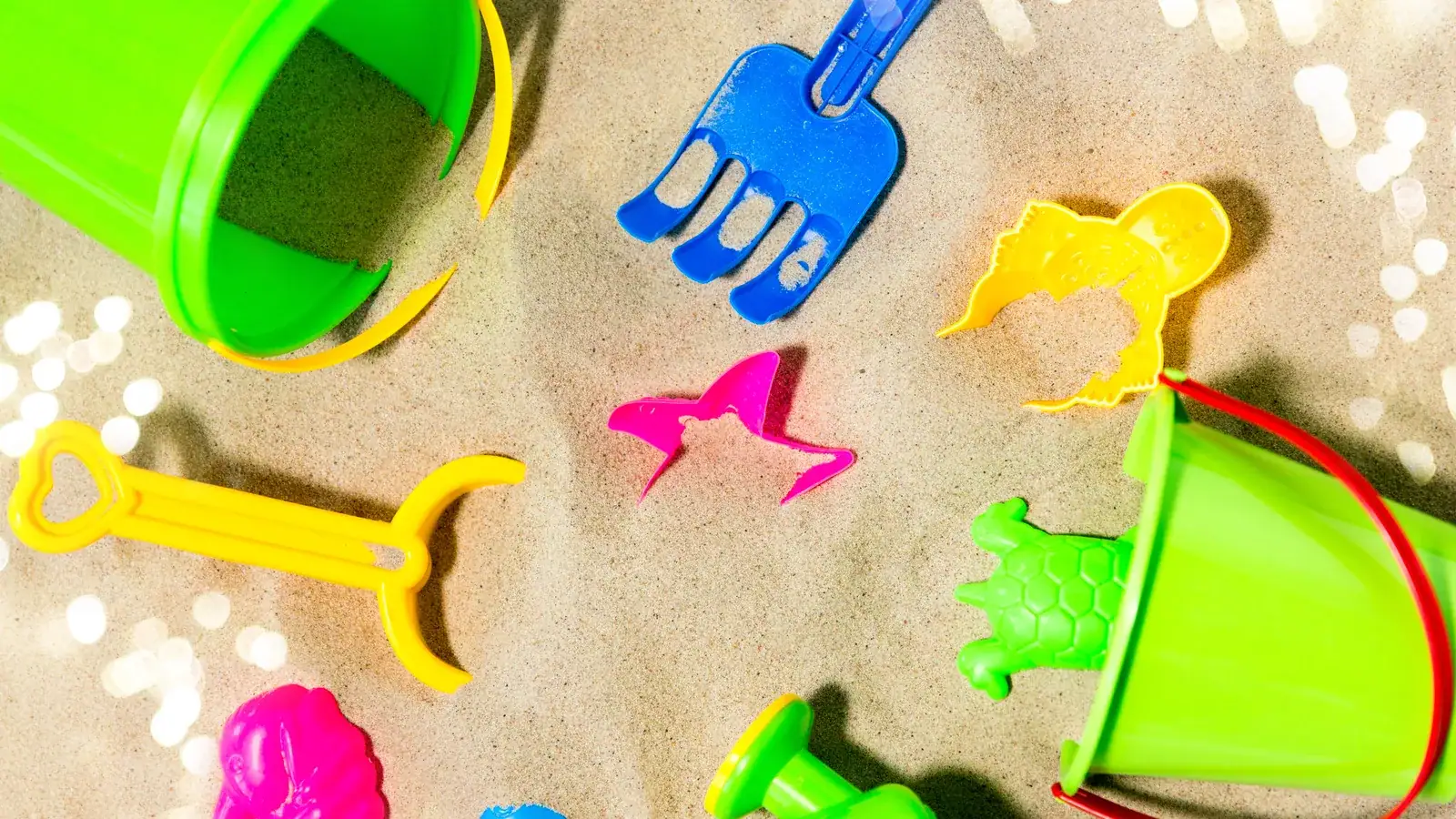 Bucket, spade and sand toys set out for outdoor water and sand play