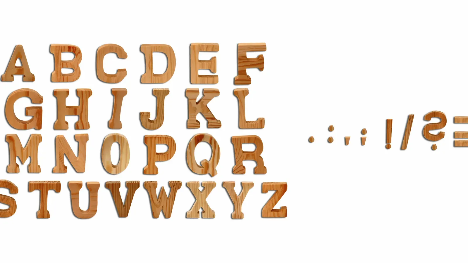Wooden alphabet letters laid out in a row on white