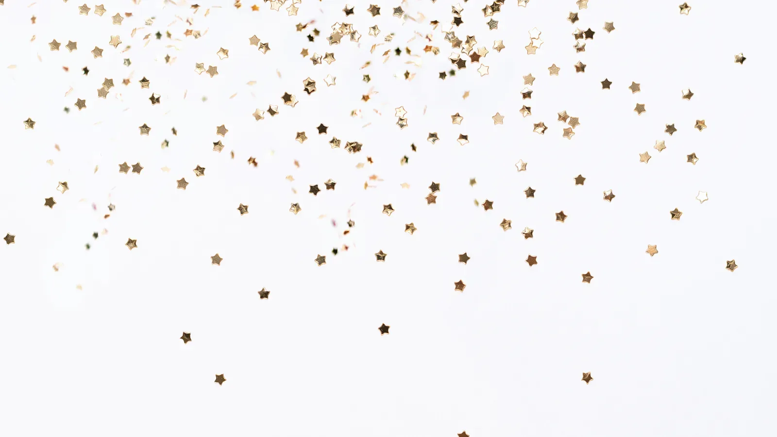 Small gold star-shaped confetti scattered across a plain white background