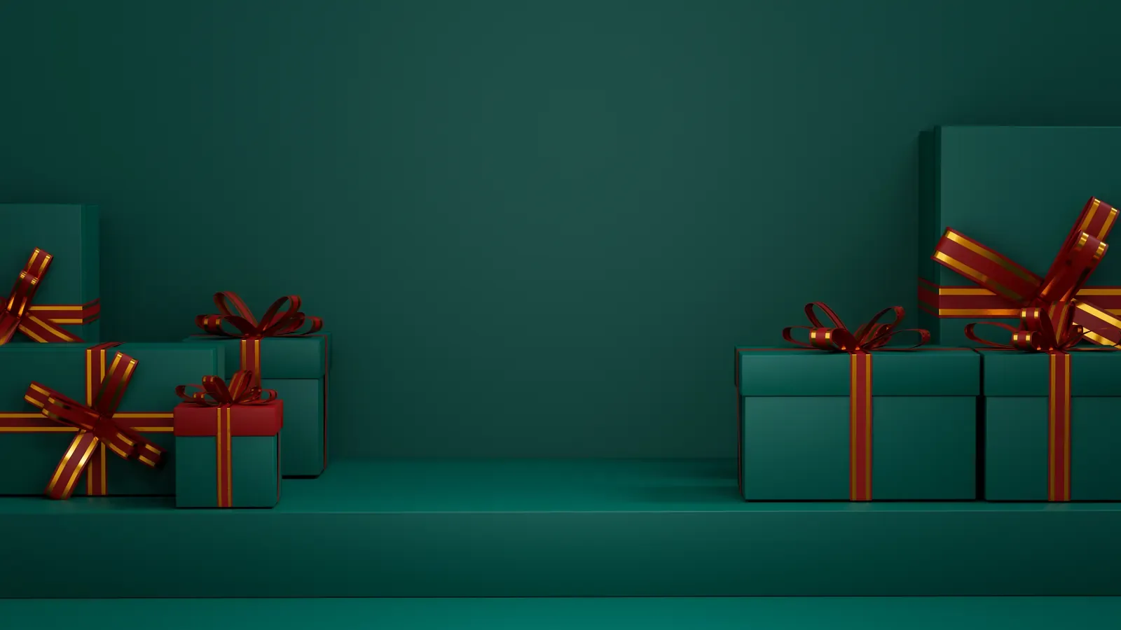 Green and red wrapped Christmas presents with red ribbon on a dark green surface